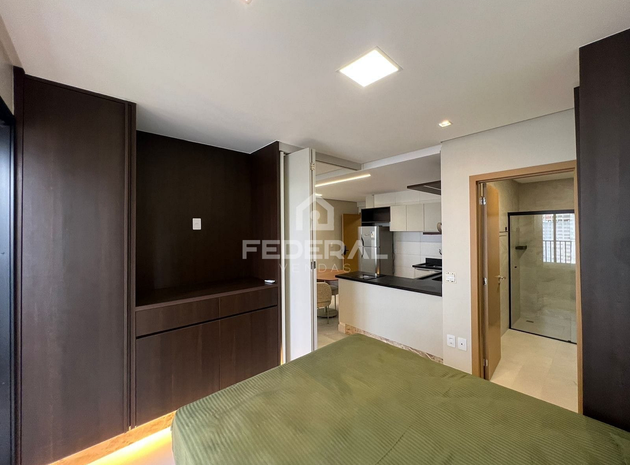 Vista integrada do quarto, cozinha e banheiro